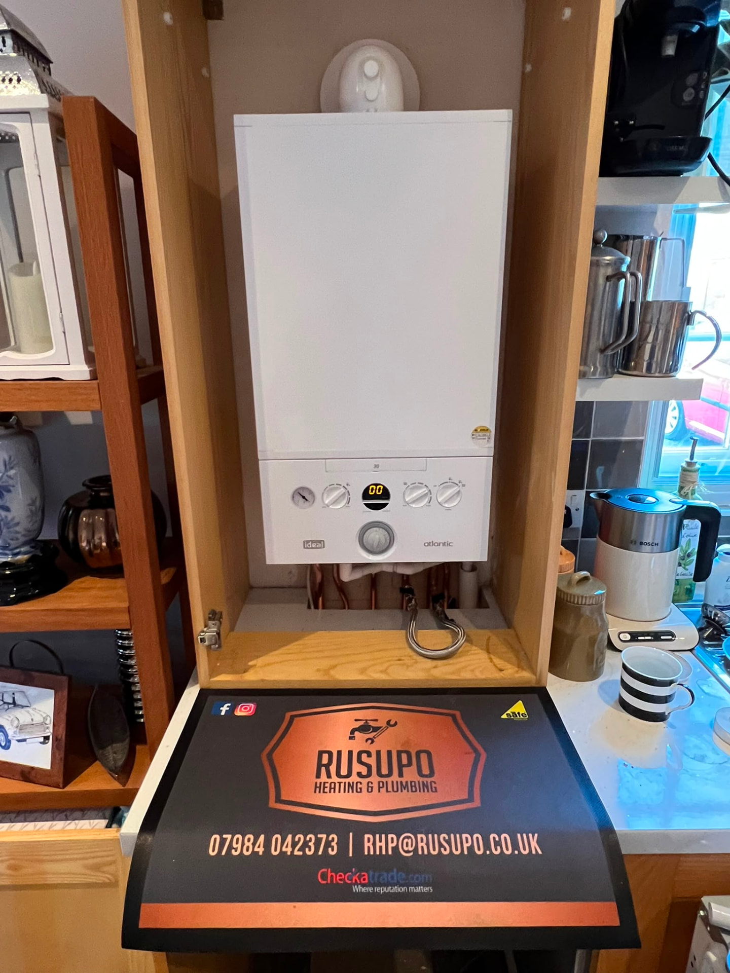 Ideal Atlantic boiler installed inside a kitchen cupboard by Gas Safe registered engineers, fitted by Gas Safe registered engineers in Essex
